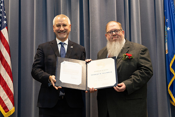 Showing the certificate.