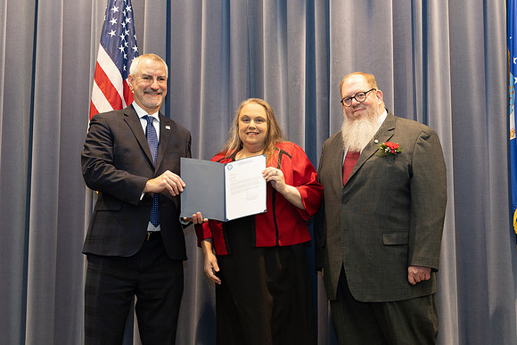 Showing the certificate.